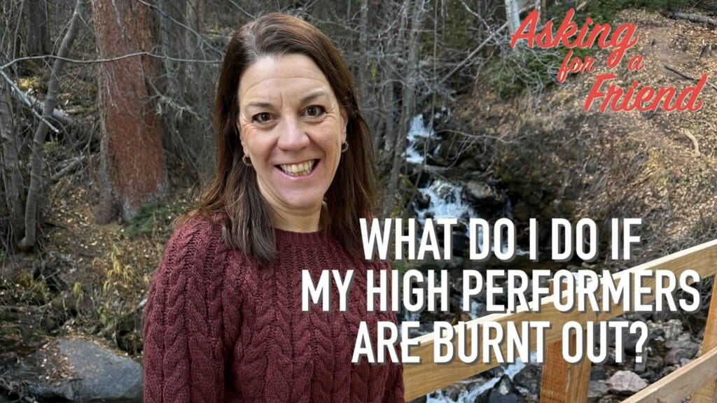 Karin Hurt, Interactive Keynote Speaker standing in front of a waterfall talking about how to keep high performer engaged.